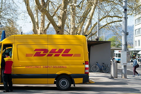 man-standing-in-front-of-dhl-truck-door-thumbnail.jpg