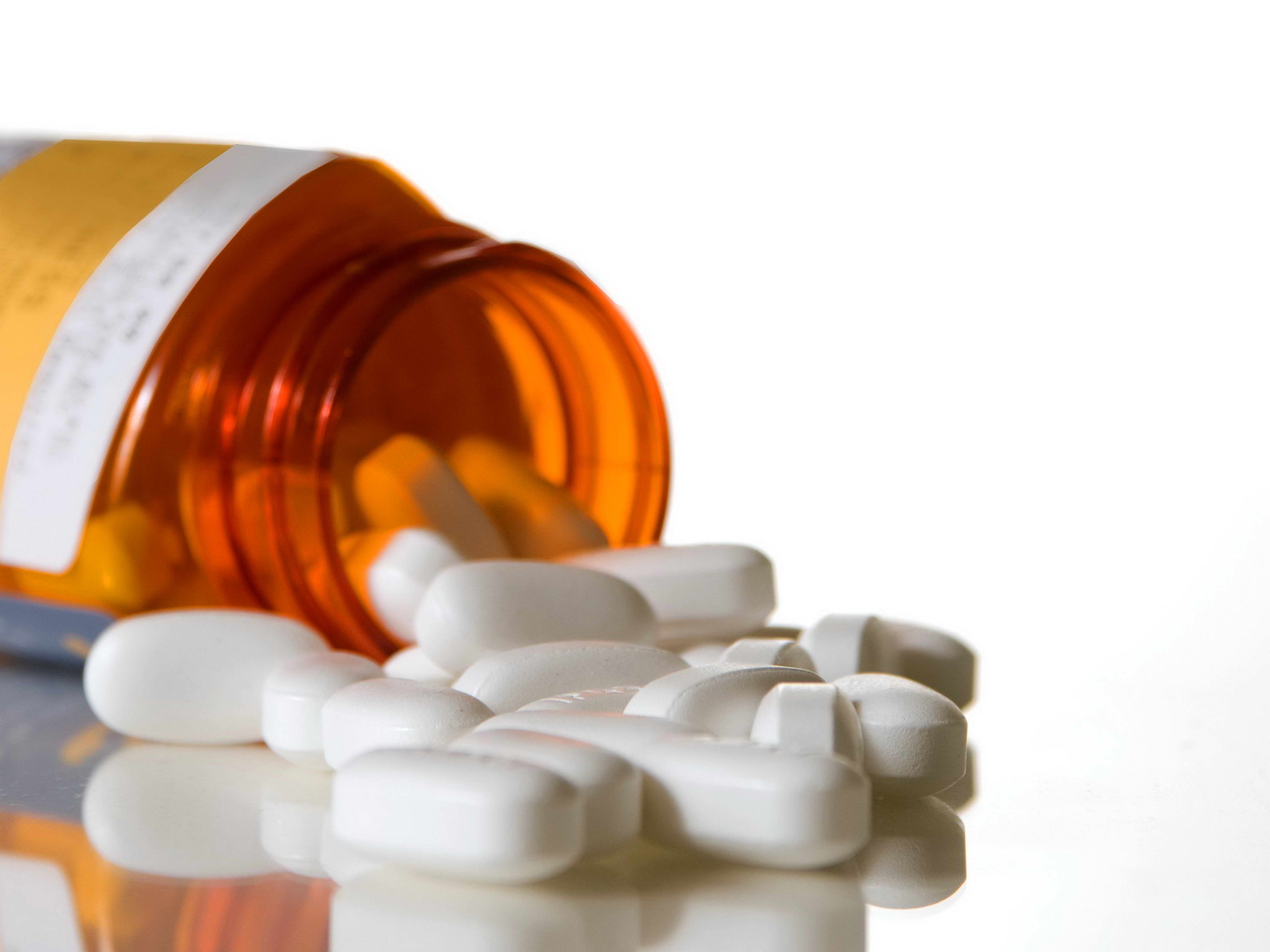 uncapped-amber-medication-bottle-and-tablets.jpg