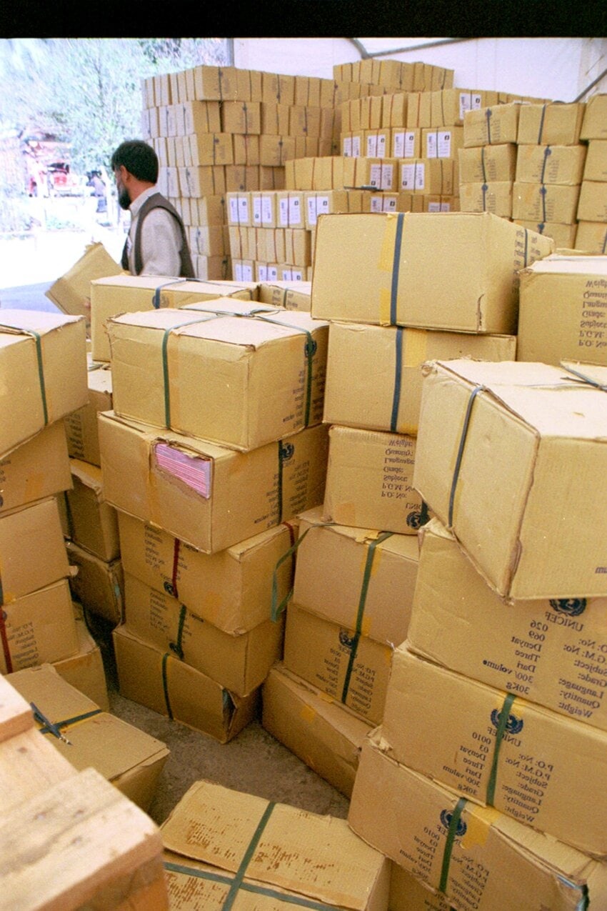 man-is-removing-and-stacking-boxes-of-new-textbooks-donated-850x1275.jpg