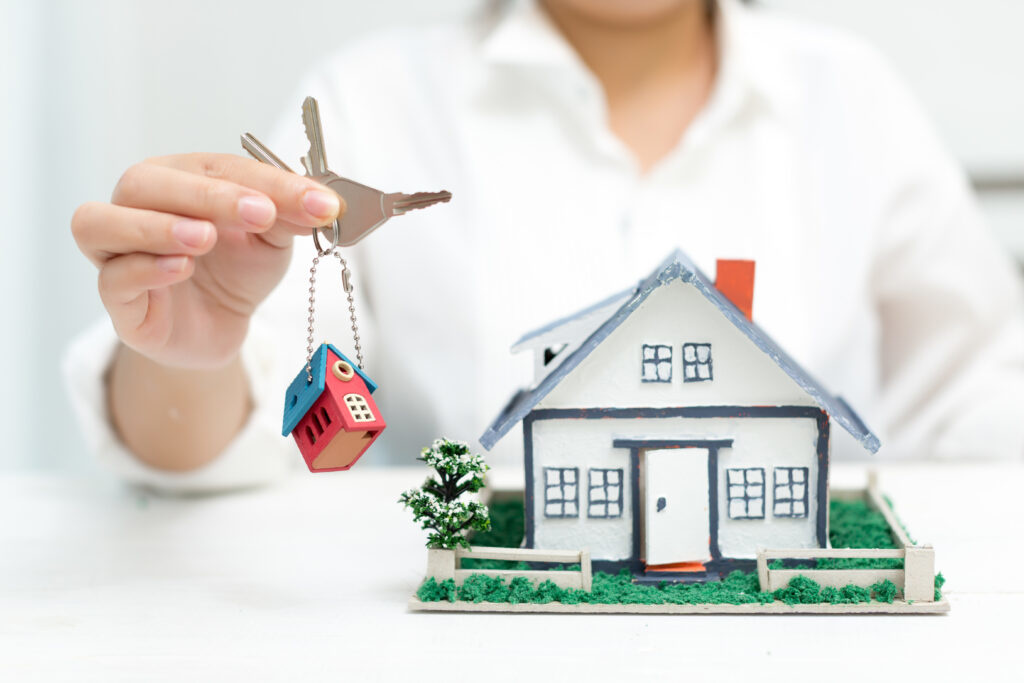 real-estate-agent-with-house-model-keys-1024x683.jpg