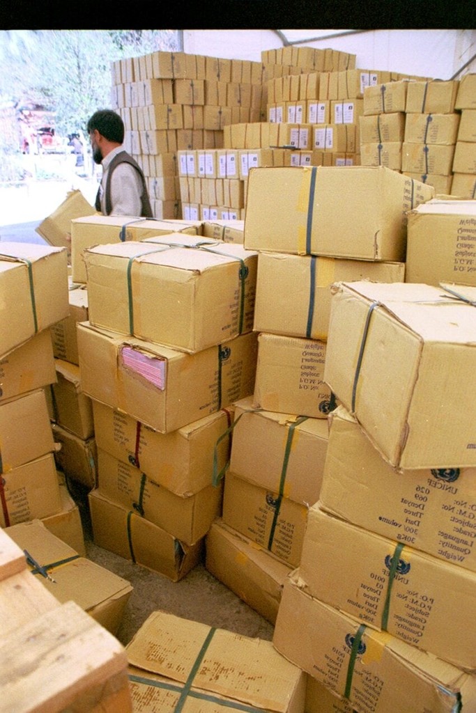 man-is-removing-and-stacking-boxes-of-new-textbooks-donated-850x1275.jpg