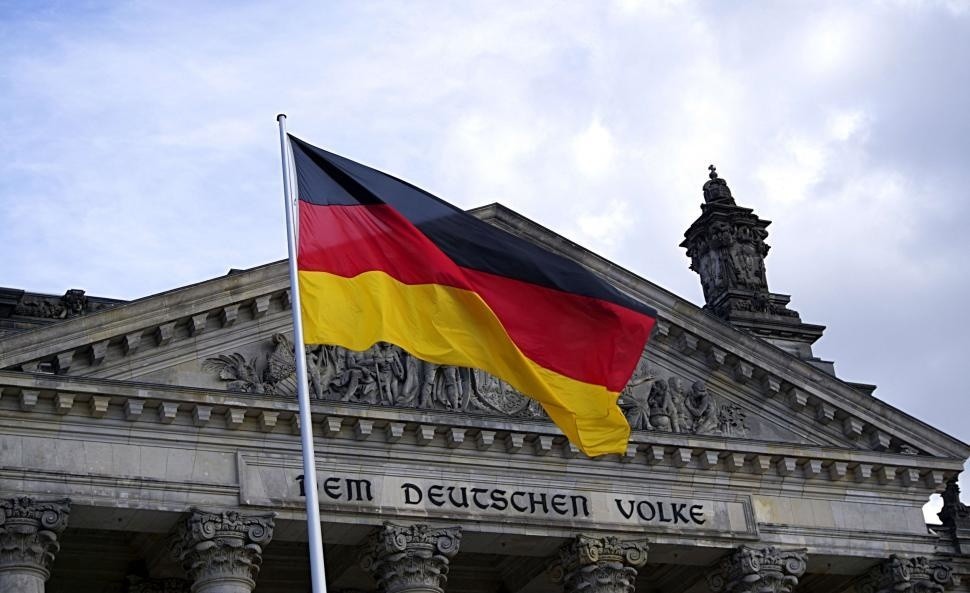 german-flag-outside-reichstag-building.jpg
